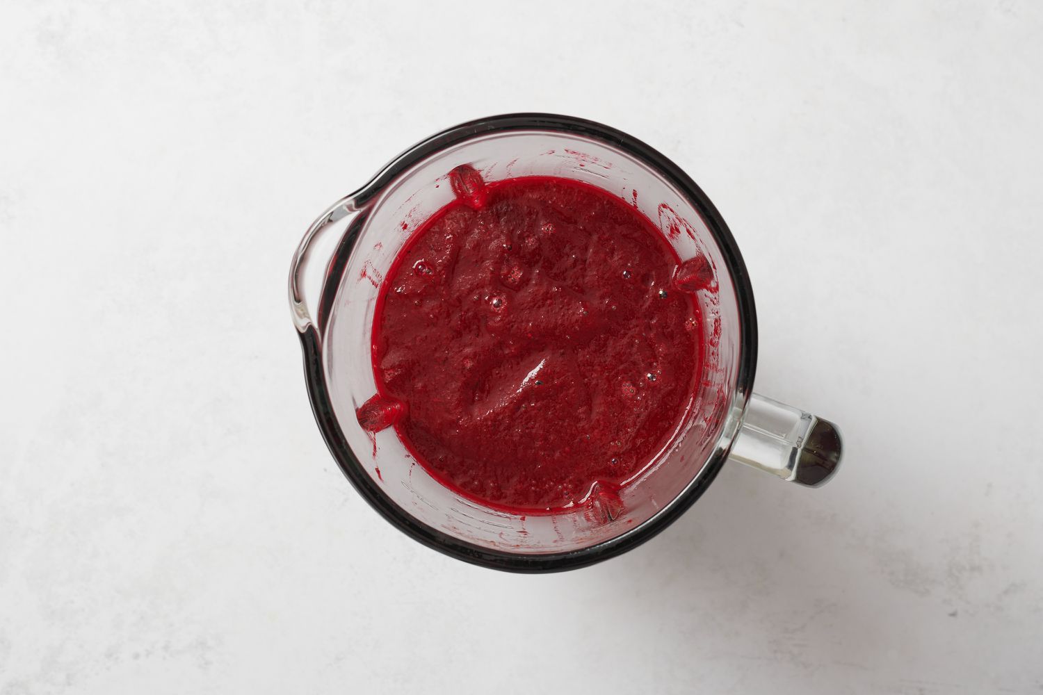 A blender with beets and other ingredients